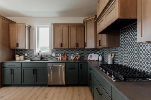 The gourmet kitchen. *Photo of similar home with the same layout.