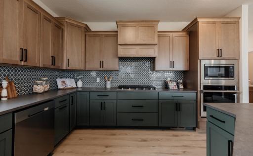 The gourmet kitchen. *Photo of similar home with the same layout.