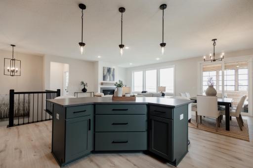 The gourmet kitchen oversized island. *Photo of similar home with the same layout.