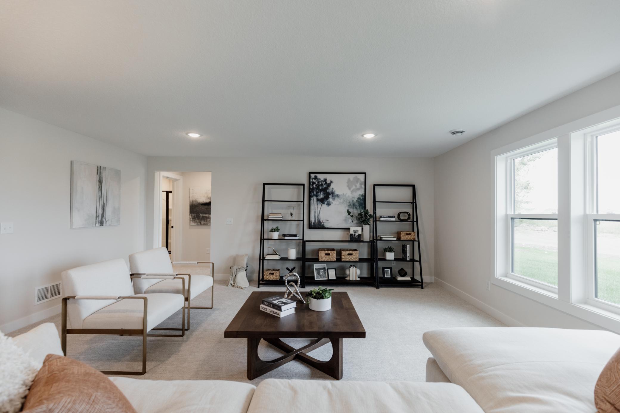 Lower level family room. *Photo of similar home with the same layout.