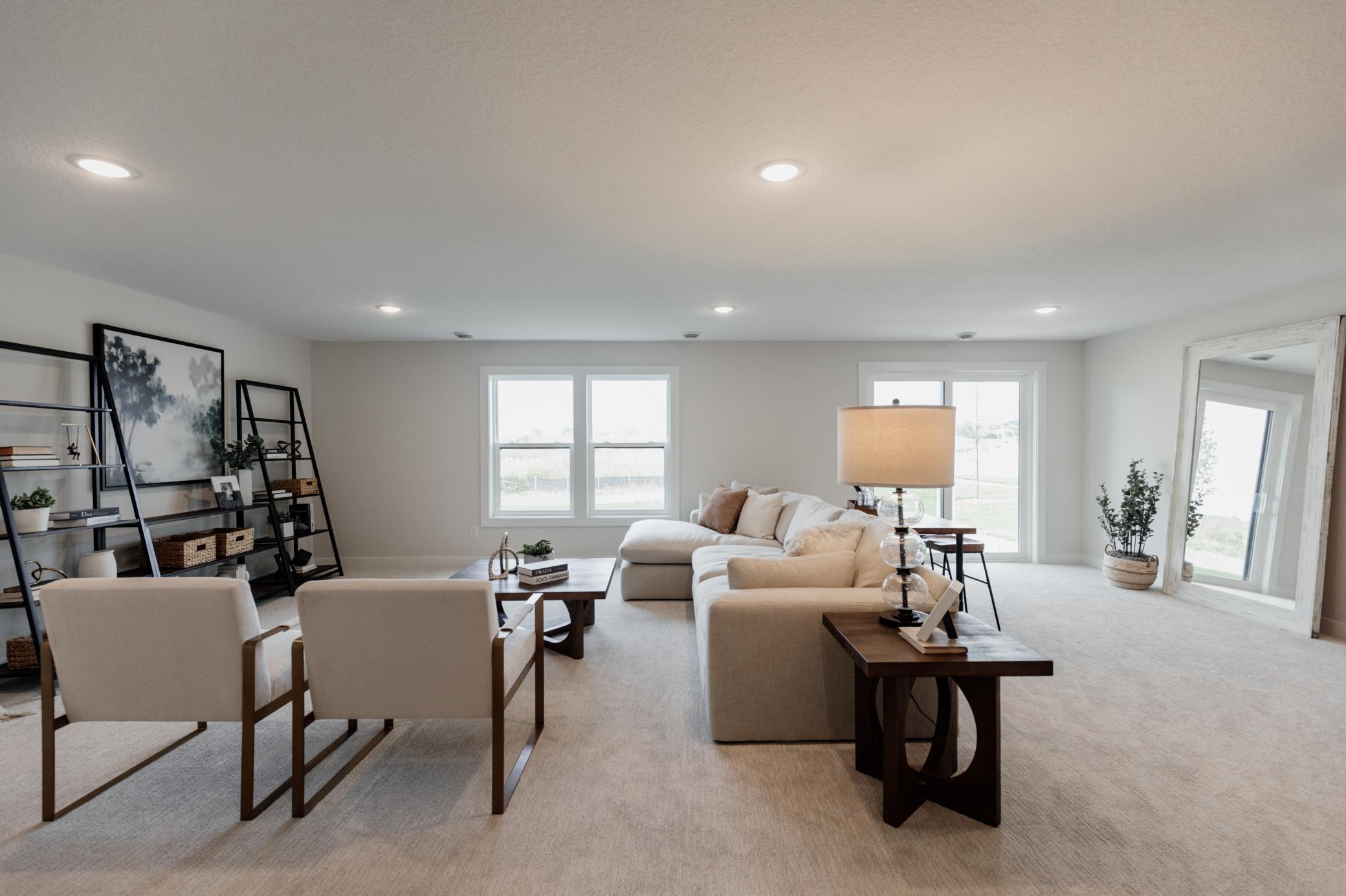 Lower level family room. *Photo of similar home with the same layout.