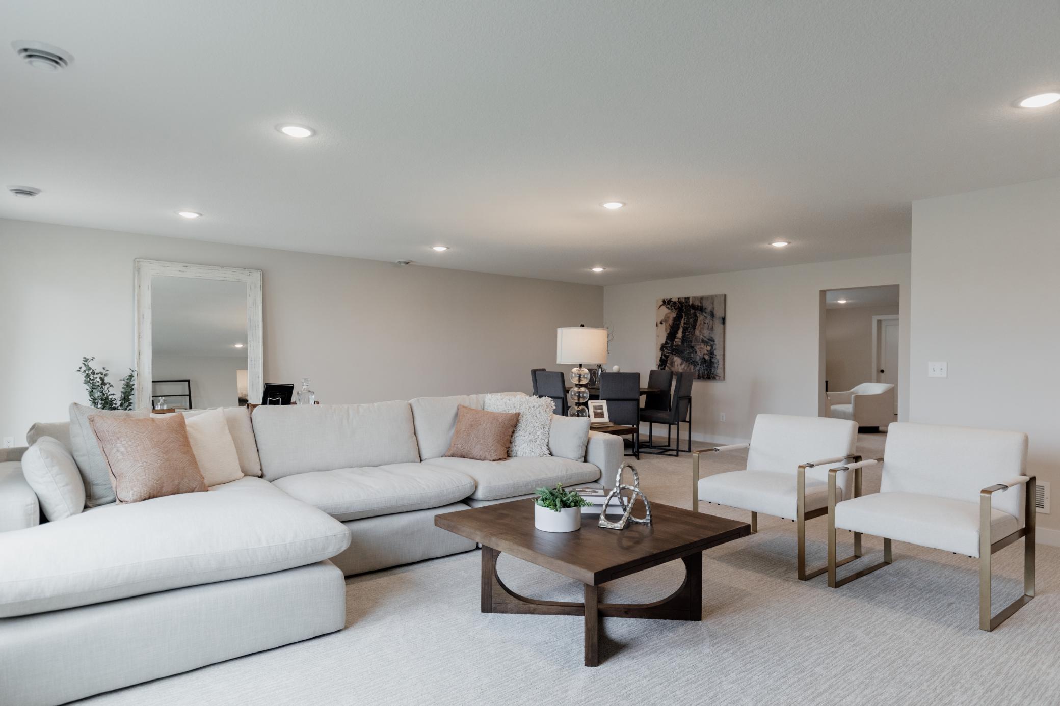 Lower level family room. *Photo of similar home with the same layout.