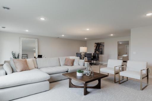 Lower level family room. *Photo of similar home with the same layout.