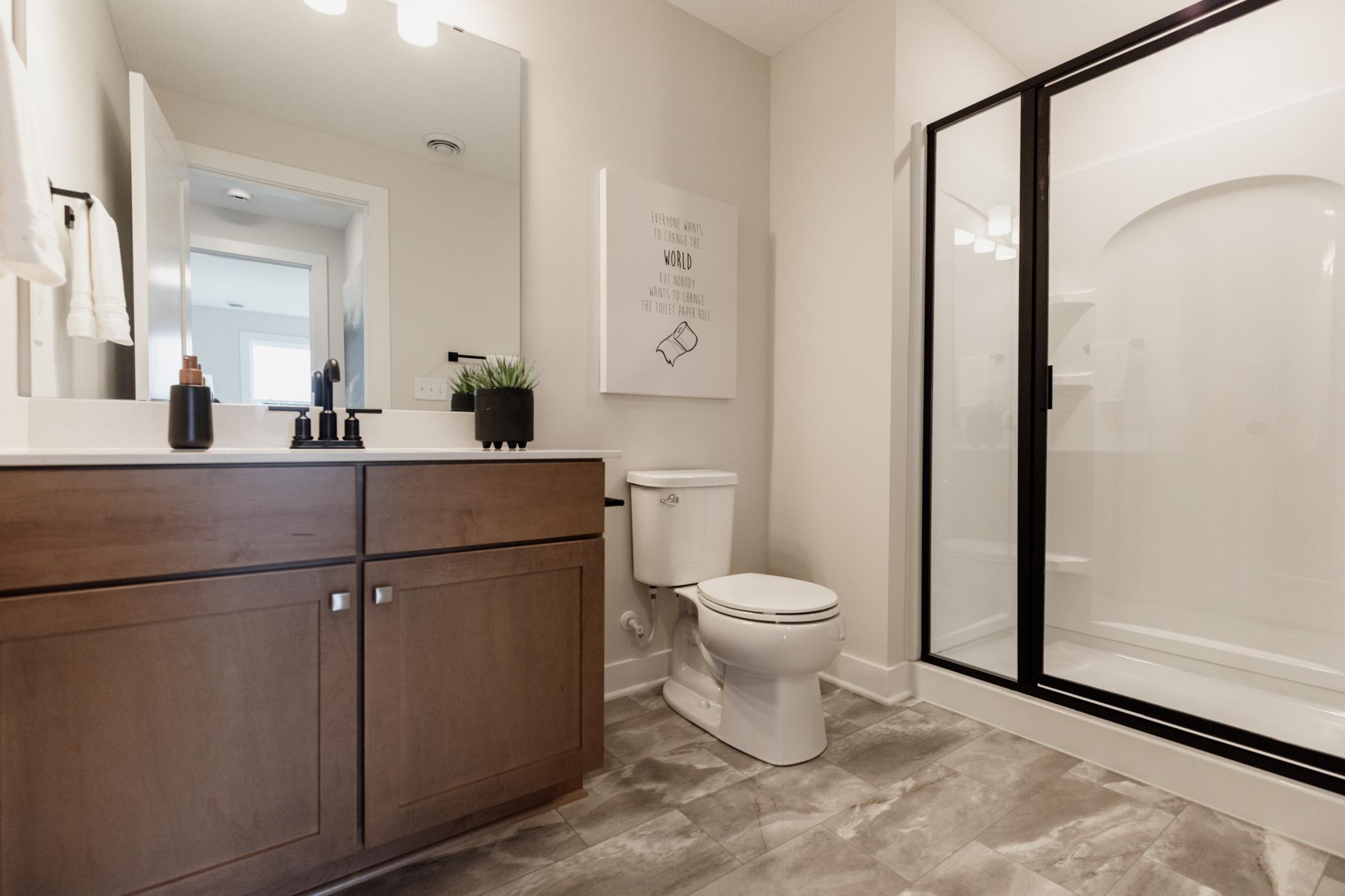 Lower level 3/4 bathroom. *Photo of similar home with the same layout.