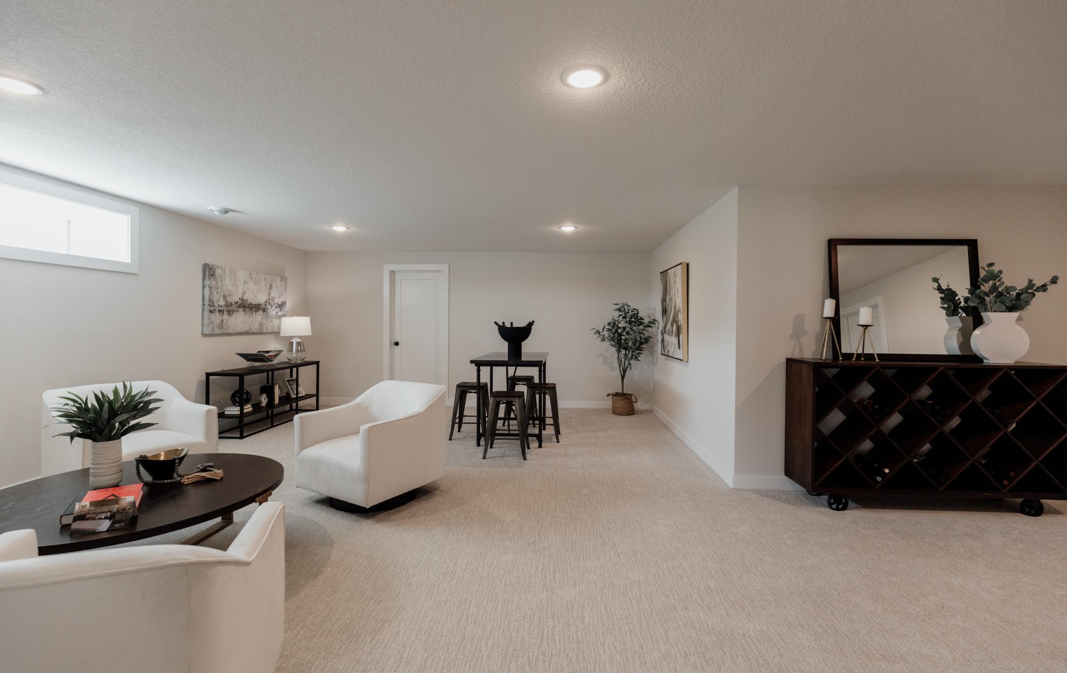 Lower level family room. *Photo of similar home with the same layout.