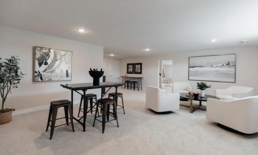 Lower level family room. *Photo of similar home with the same layout.
