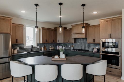 The gourmet kitchen. *Photo of similar home with the same layout.