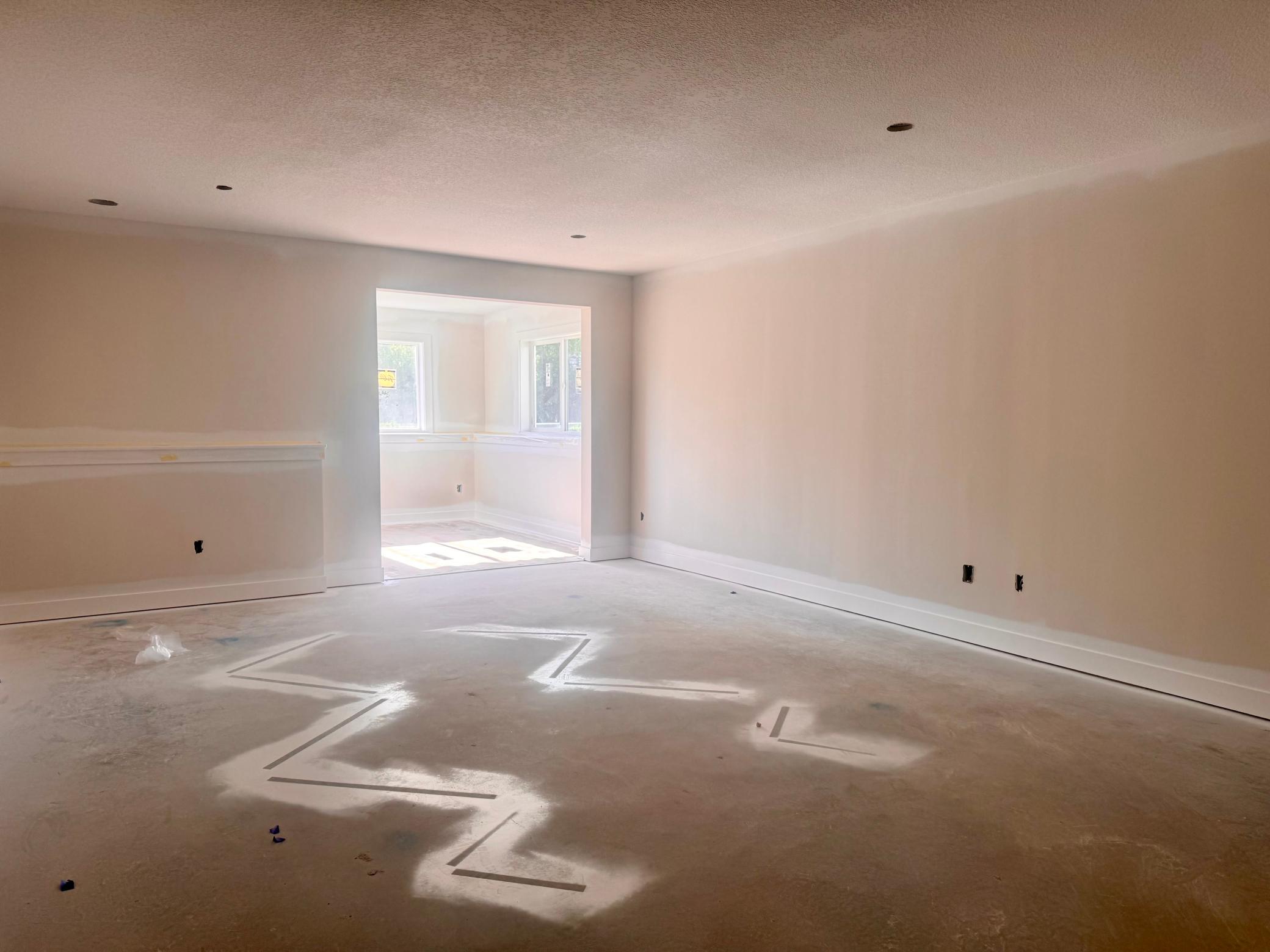 Progress photo of the lower level family room and sunroom/game room