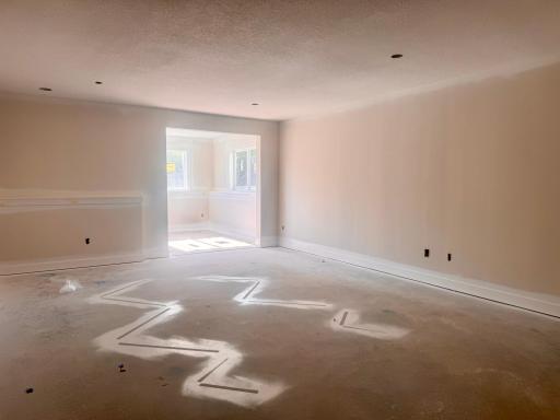 Progress photo of the lower level family room and sunroom/game room