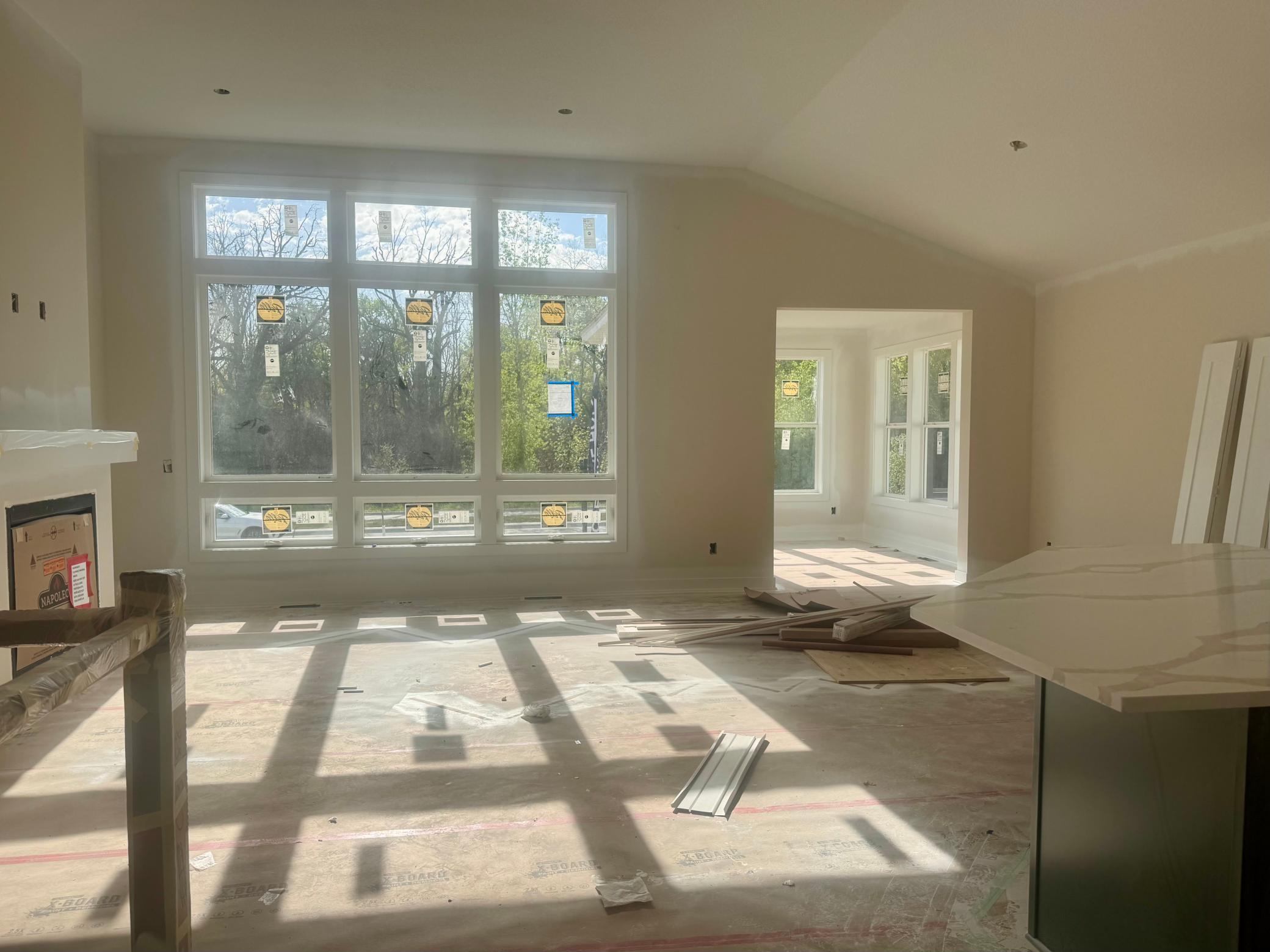Progress photo of the main floor living space with vaulted ceilings
