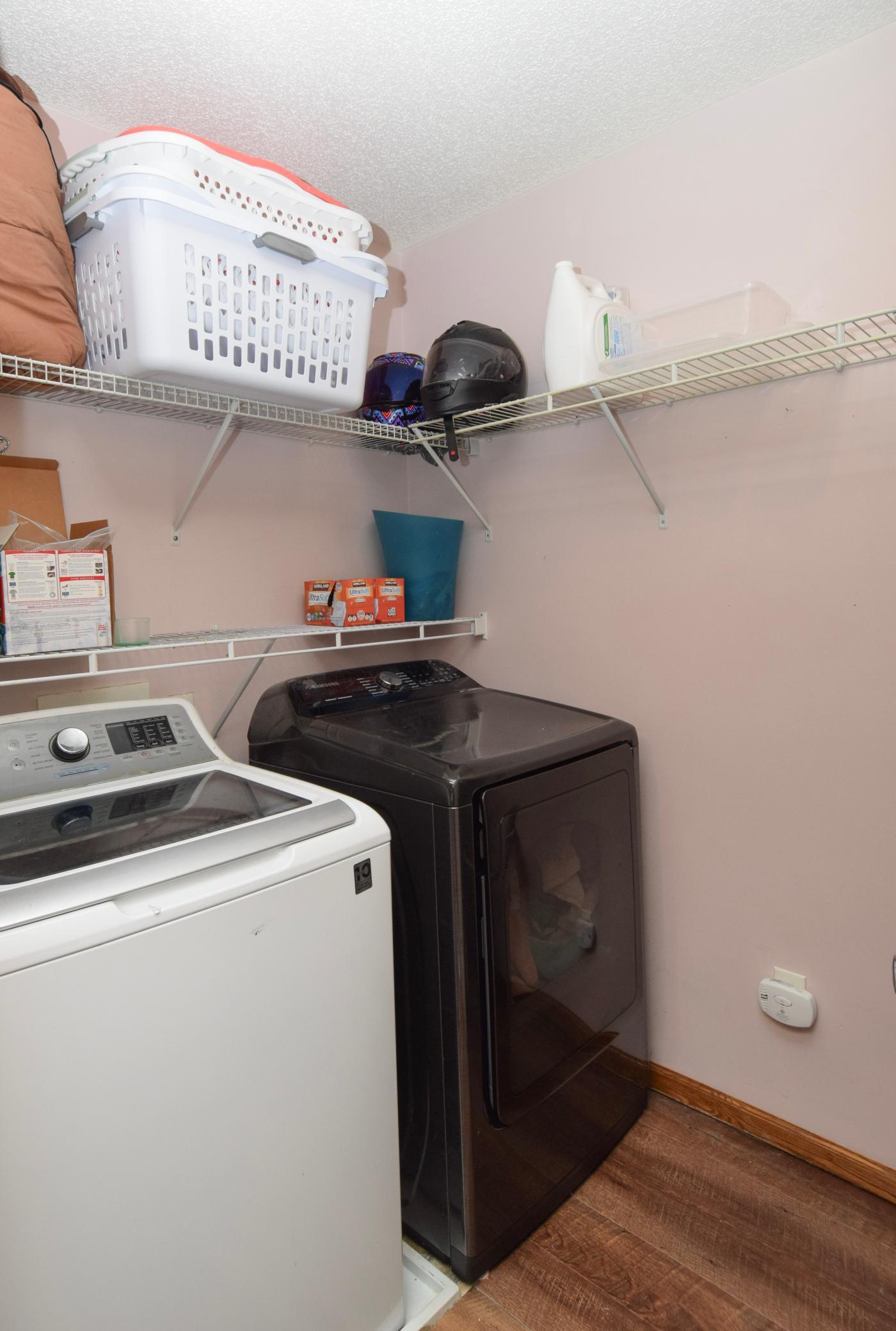 Lots of shelving and extra storage in the laundry room