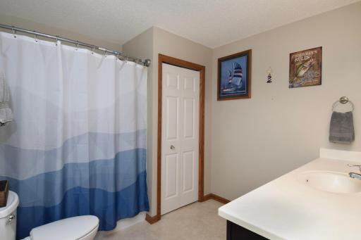 Primary full bathroom with additional walkthrough to the main hallway to put clothes in the laundry.