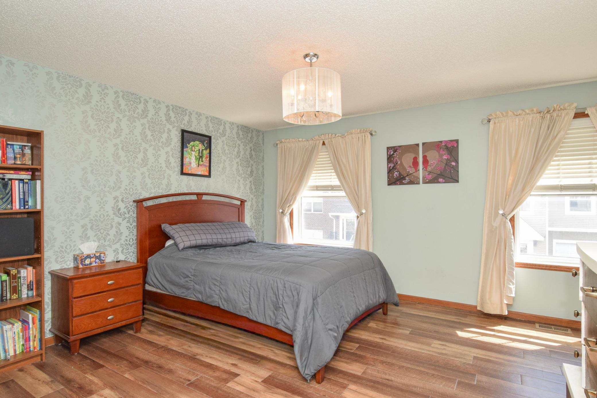 Primary suite with lots of light and room for plenty of space for a king or queen bed along with dressers and nightstands