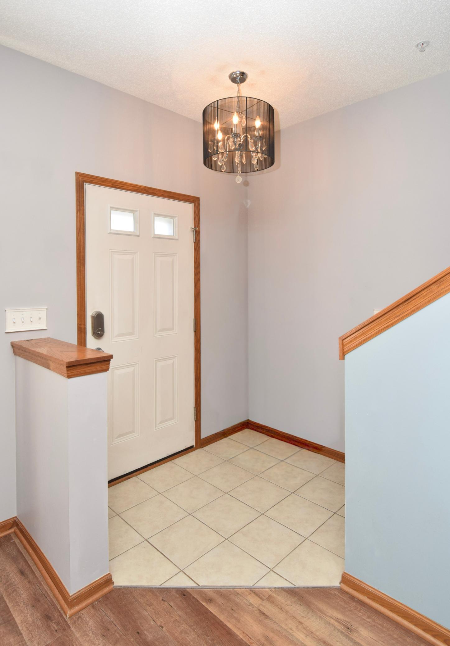 Entryway with decorative light.