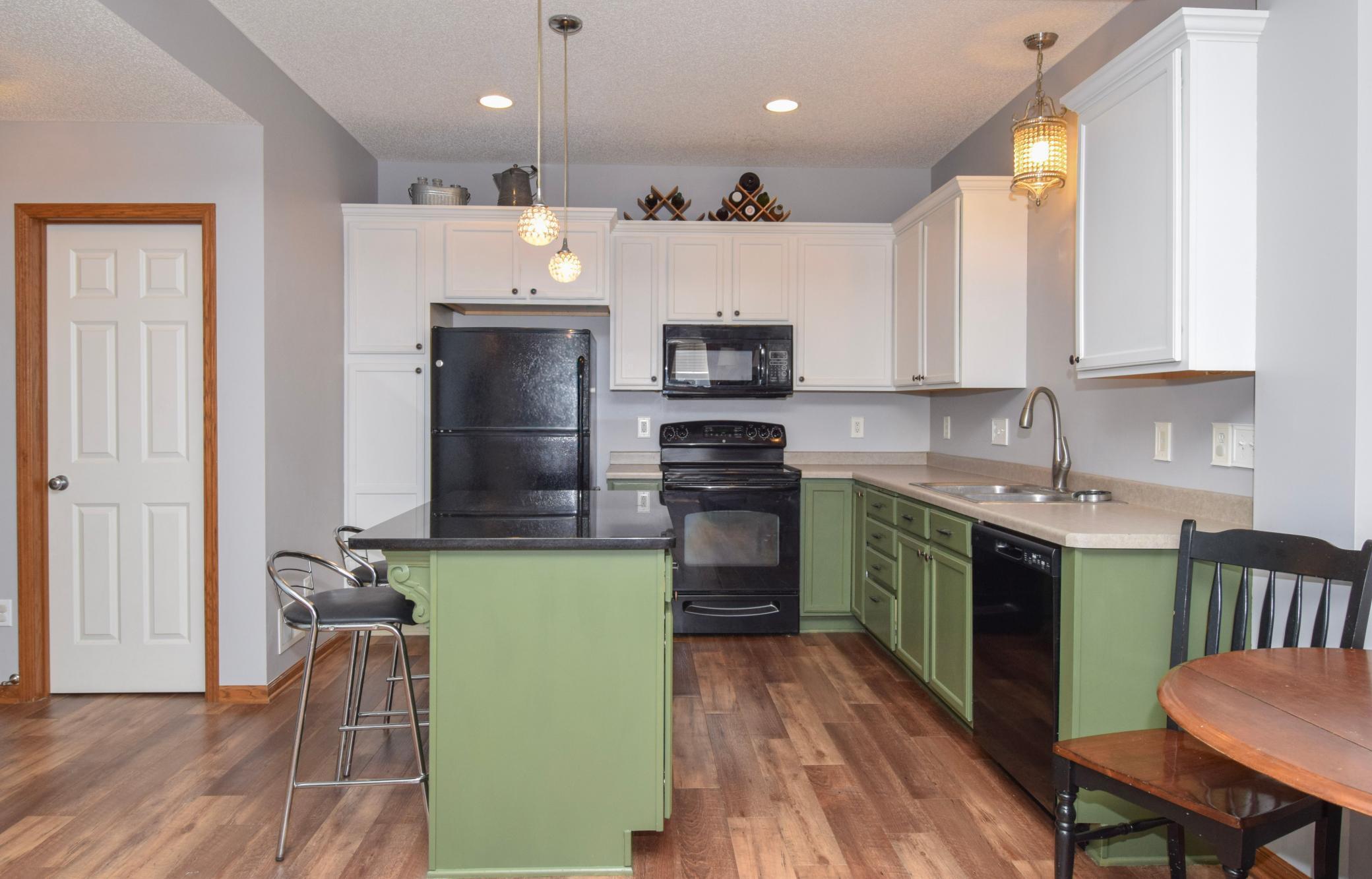 Perfect breakfast bar area and lots of cabinets for storage.