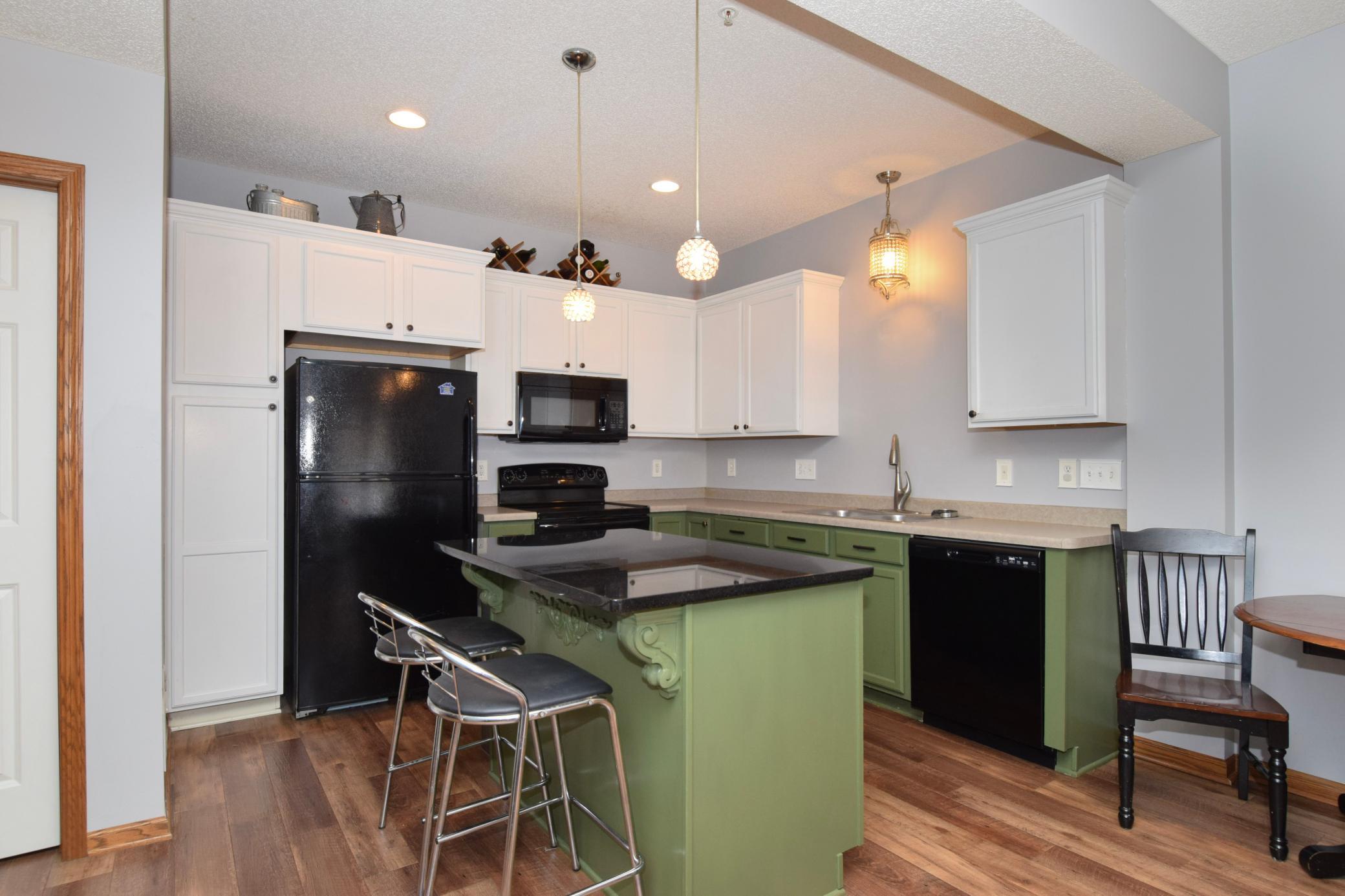 Recently painted kitchen with granite topped island