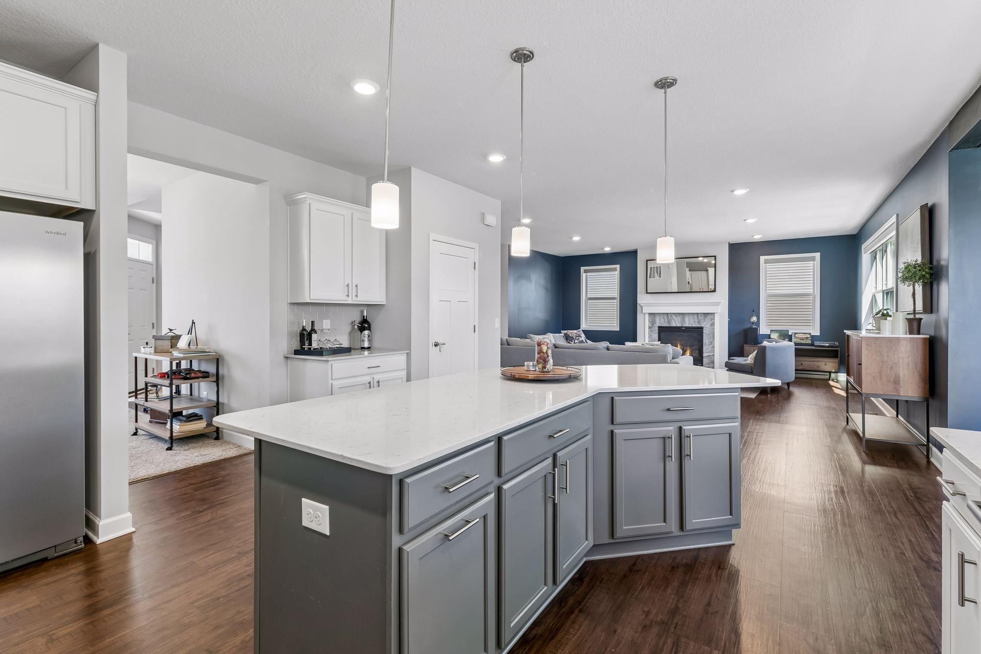 Kitchen looking into formal dining room and huge living room