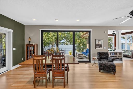 Dining Room features full glass French doors that provide access to the covered porch & sliding glass door to the deck