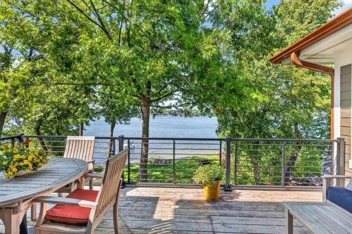 Deck features metal railings and cedar decking. Great space for relaxing and entertaining!