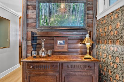 Additional reclaimed wood paneled nook provides a space to display furniture or could be a future beverage center!