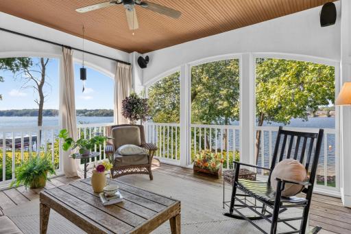 Screened In Porch features arched openings, Beadboard ceilings, craftsman style wrapped posts and cedar decking. Access to the deck and a true extension of living space!
