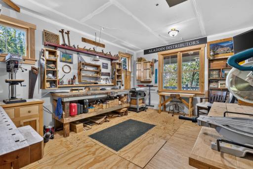 Flex Room is heated and finished. Built-in workbench and has access to the finished crawlspace for additional storage. Being used as a workshop.