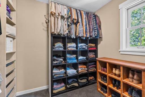 Walk-in closet features custom organizer and natural light!