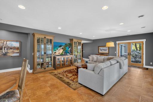 Family Room features doors that lead to the property and lake