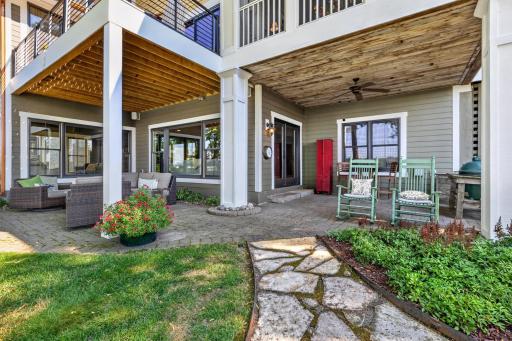 Lower Patios feature wood paneled ceiling with fan, decorative paver flooring and craftsman style wrapped pillars. Perfect space to hang out by the lake!