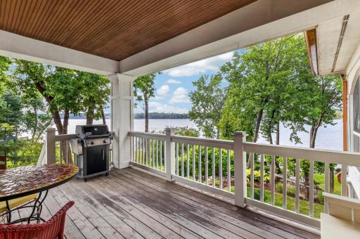 Back porch offers stairs to the lake and property