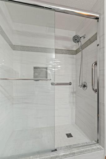 Beautiful walk-in tile shower with easy access â no stepping over a tub, making it a safe and convenient option.