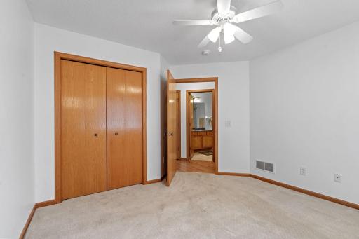 Additional bedroom perfect for guests, featuring a large closet and a bright south-facing window.