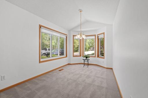 Eat-in dining area featuring a beautiful east-facing bay window that fills the space with warm morning sunlight.