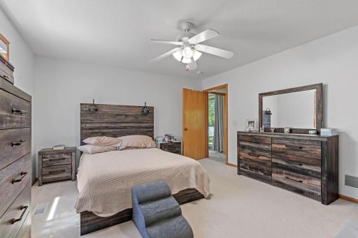 Spacious primary suite featuring a large walk-in closet and private ensuite bathroom.