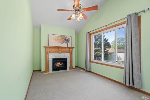 Cozy den with a warm gas fireplace â the perfect place to snuggle up with a good book, enjoy a cup of coffee, and relax.