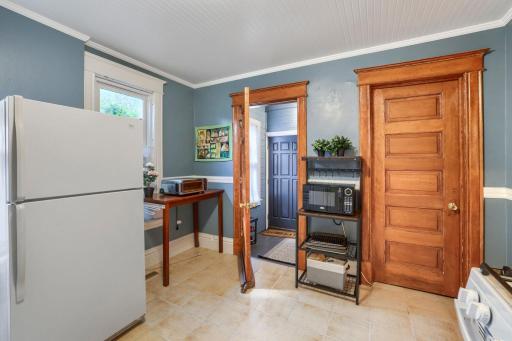 Kitchen - showing door to the outside (on the left) and door to a walk-in pantry (on the right)