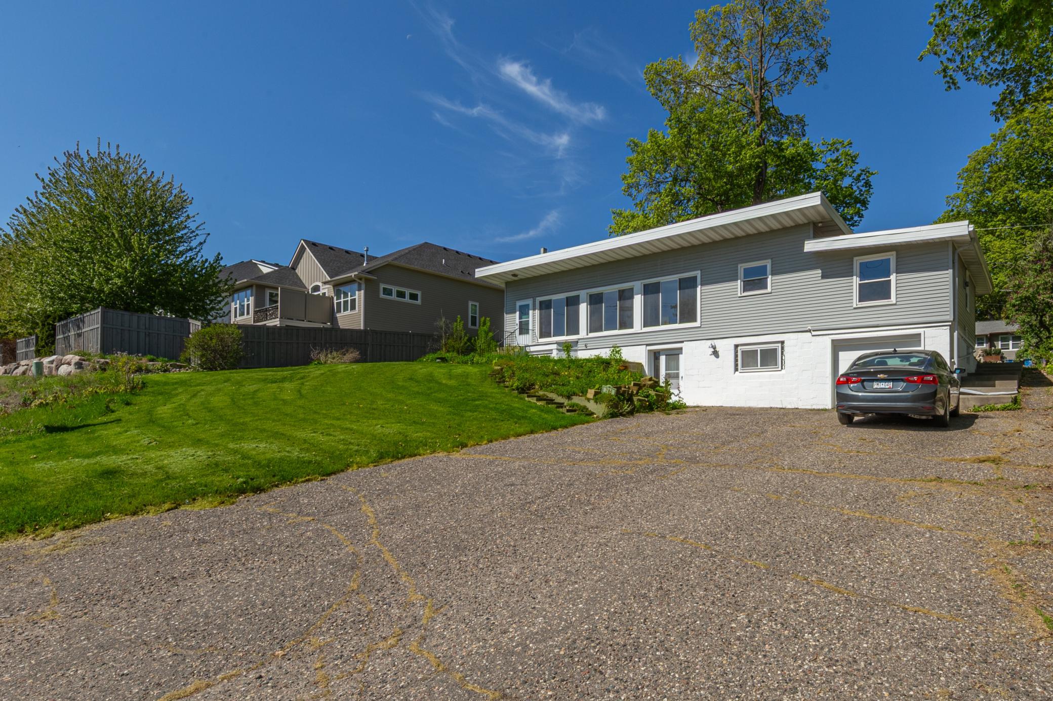 Large driveway in the front of the house