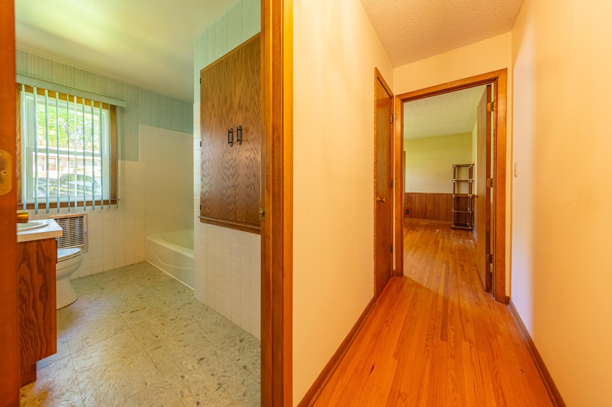 Main floor hallway where 2 bedrooms and bath are located