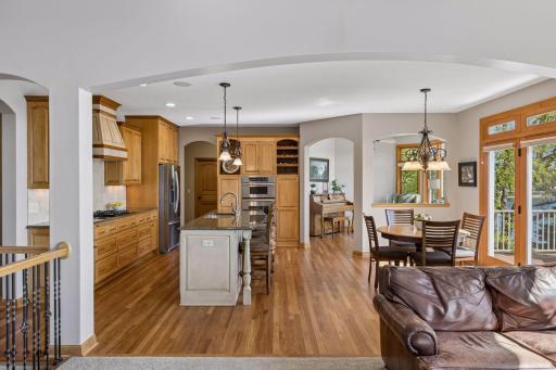 Refinished wood floors extend throughout the main level, adding warmth and continuity
