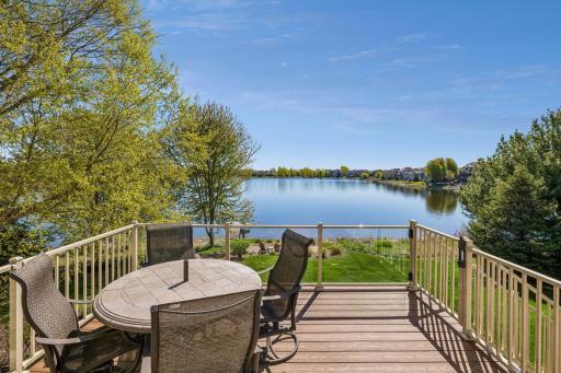 Just off the kitchen and informal dining area, a generous deck offers panoramic views of Sunrise Lakeâideal for morning coffee or evening dining