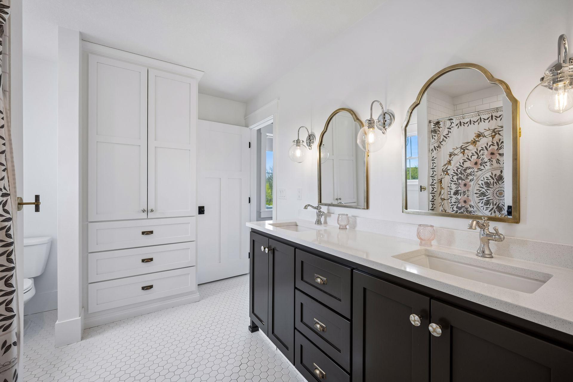 Full upper level bathroom connecting bedrooms 1 and 2.