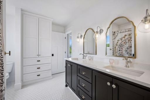 Full upper level bathroom connecting bedrooms 1 and 2.