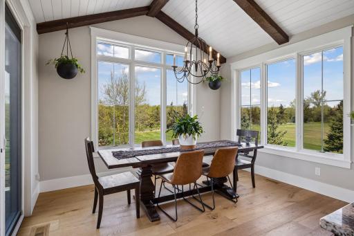 Spacious dining room with a sliding patio door leading to the deck.