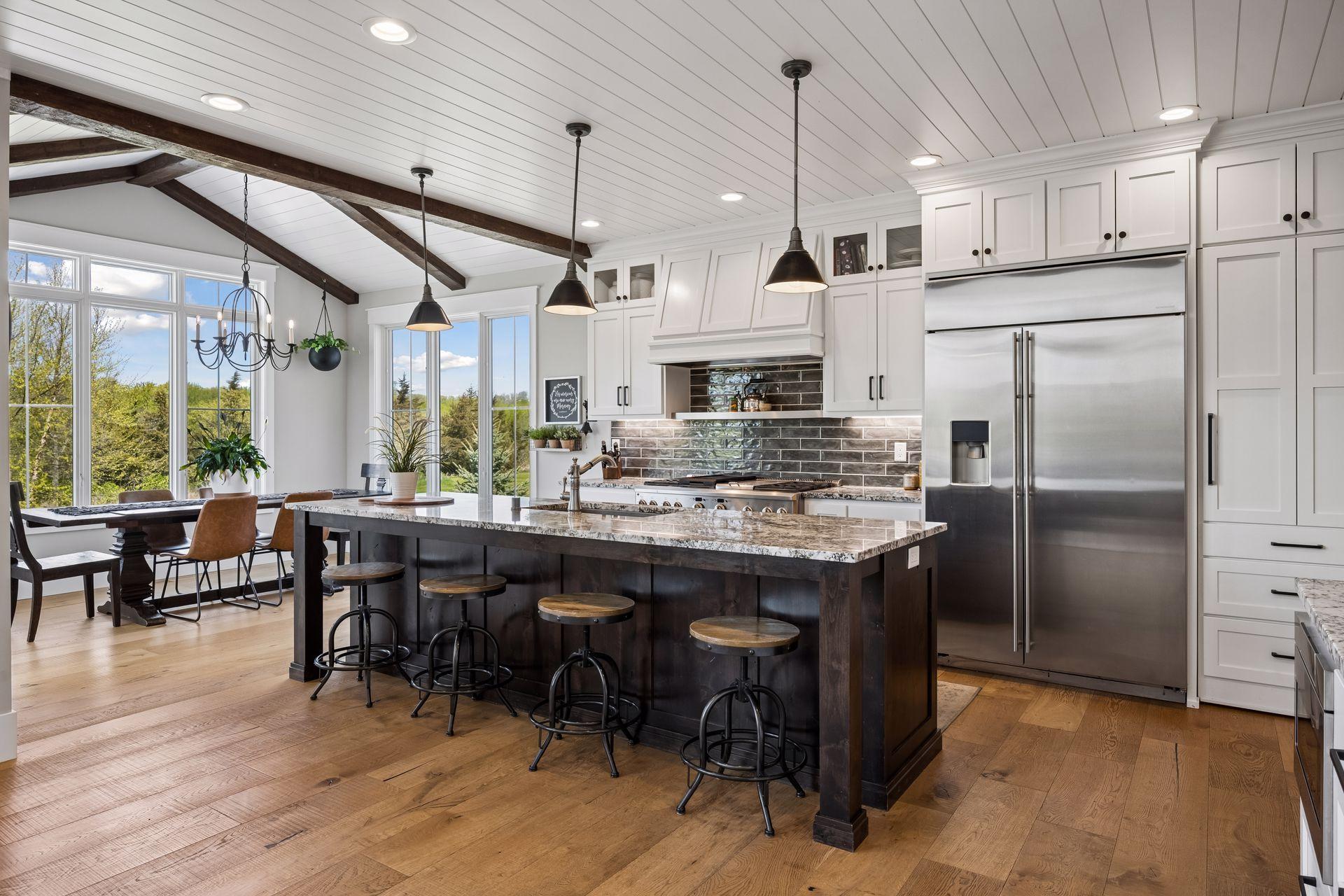 An expansive center island anchors the space, complemented by abundant counter space and extensive custom cabinetry.
