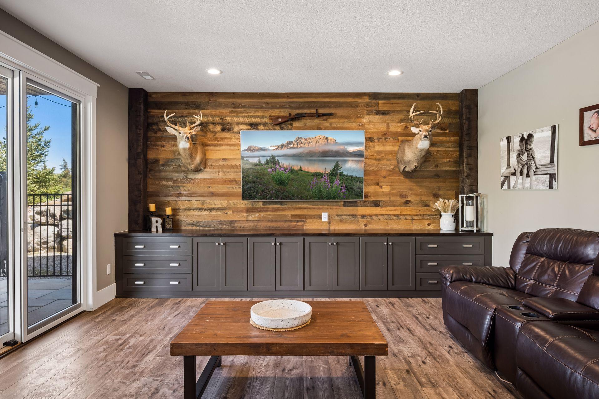 The inviting family room features custom built-ins and a sliding patio door that opens directly to the outdoor hot tub.