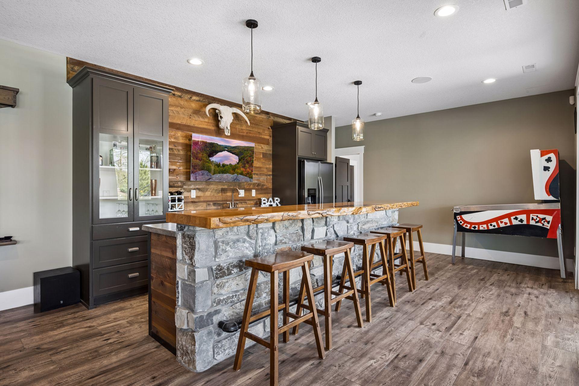 Custom wet bar with full refrigerator and dishwasher! A second sliding door off the bar leads to the backyard oasis!