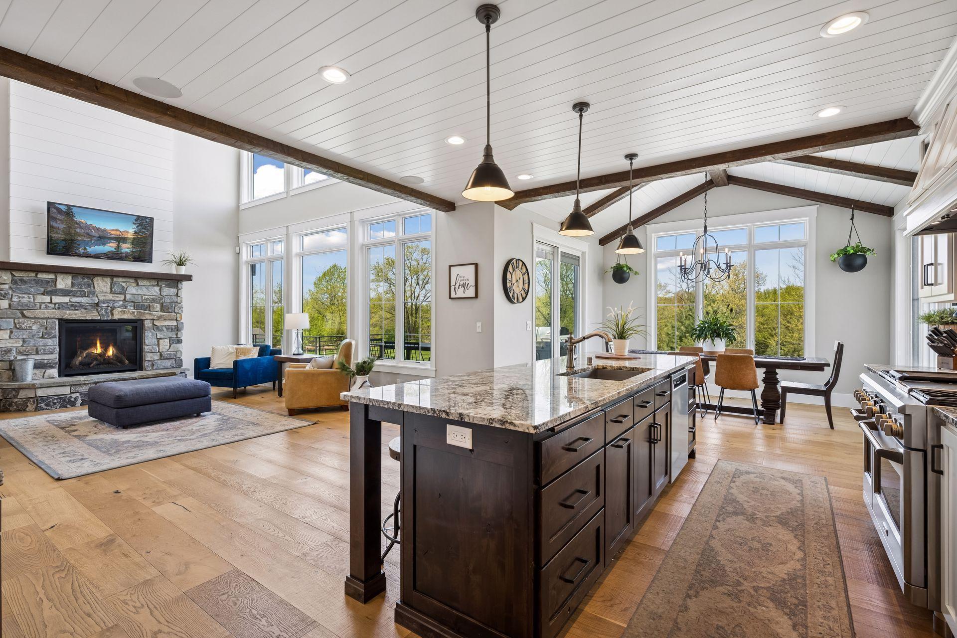 Expansive windows flood the home with natural light while showcasing breathtaking views.