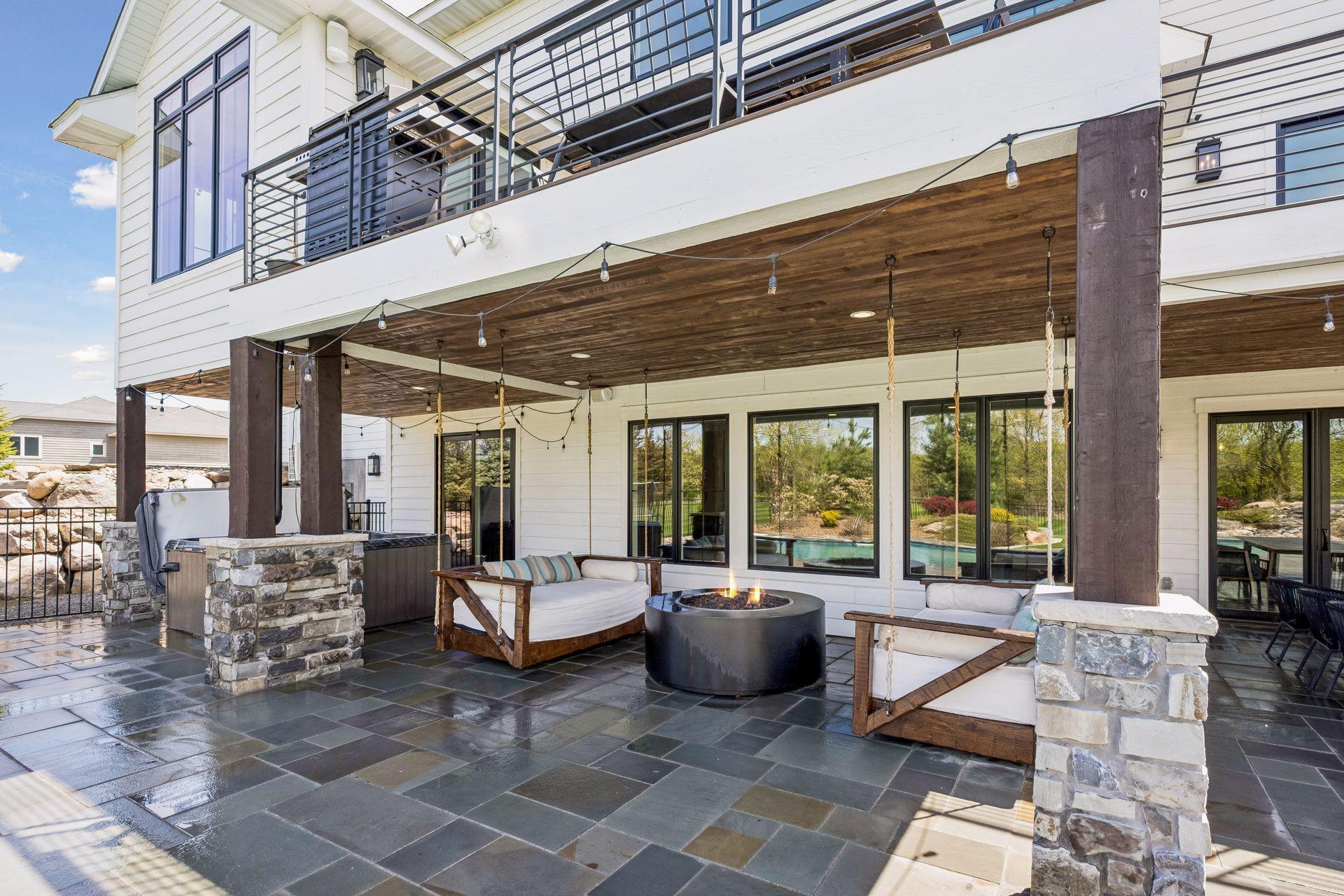 Hanging day beds surround the built in gas firepit.