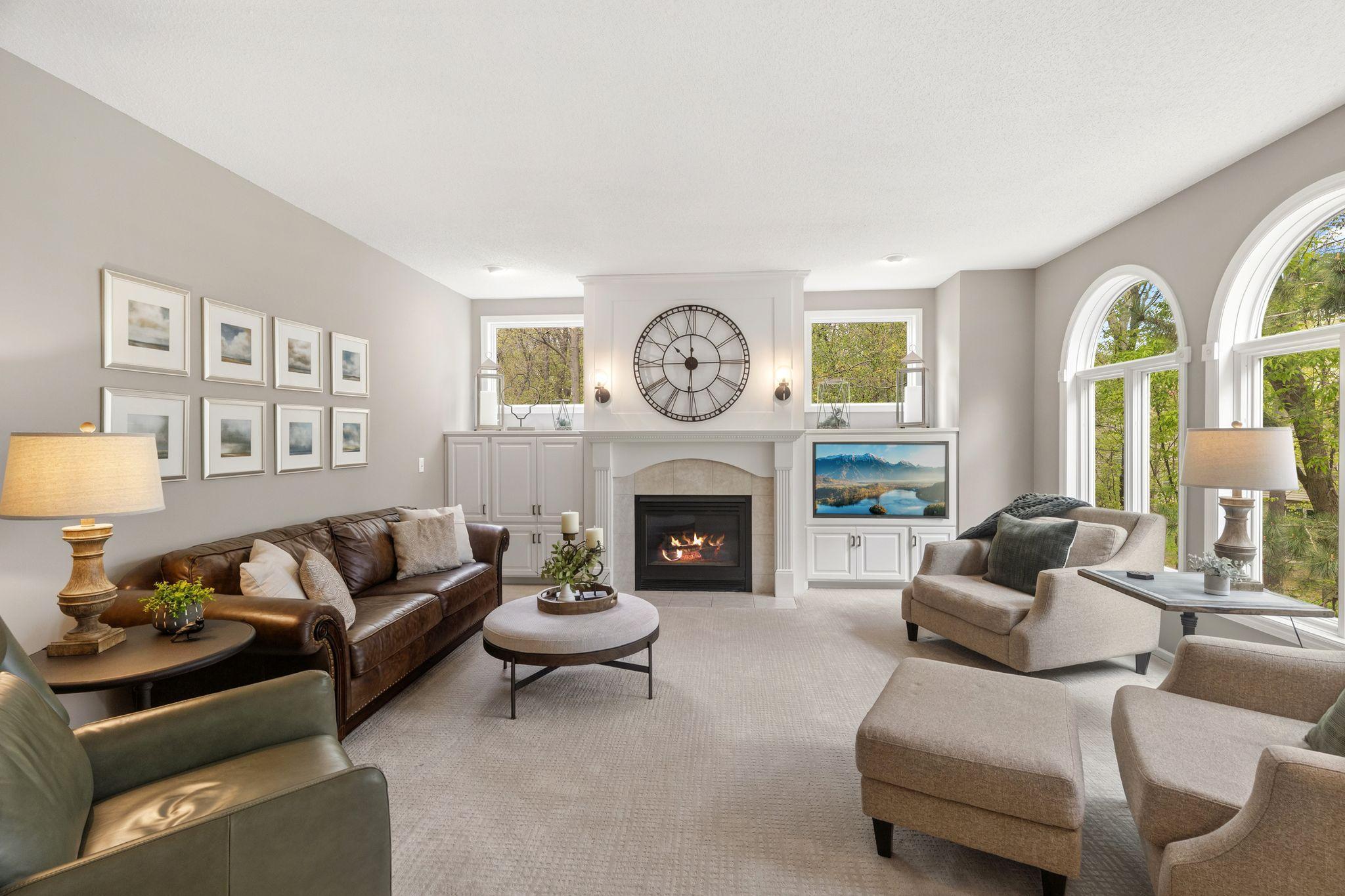 Bright family room with built-ins and gas fireplace