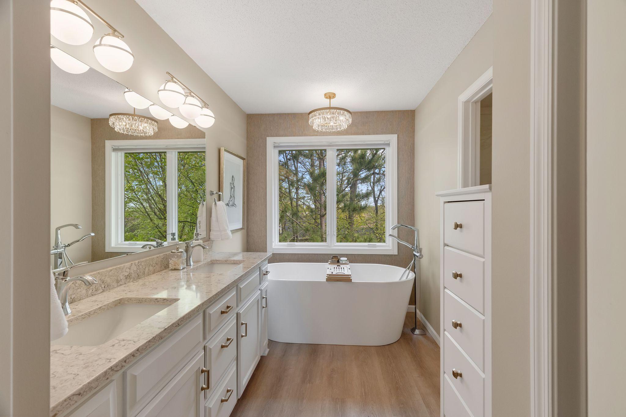 Completely remodeled spa-like bath with granite, soaking tub and tiled shower